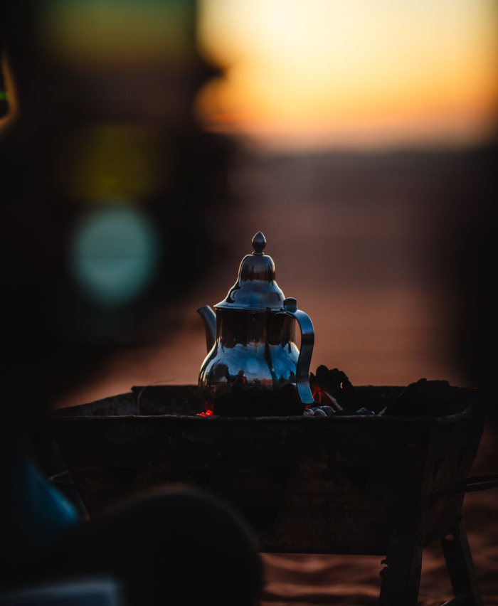 Moorish teapot with the desert sunset in the background