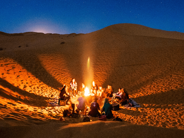 Campfire at night in Merzouga dunes